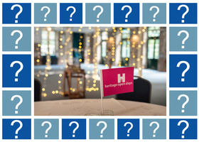 Photo of pink hand waving flag on a table in a room lit by fairy lights. Surrounded by graphics of question marks.