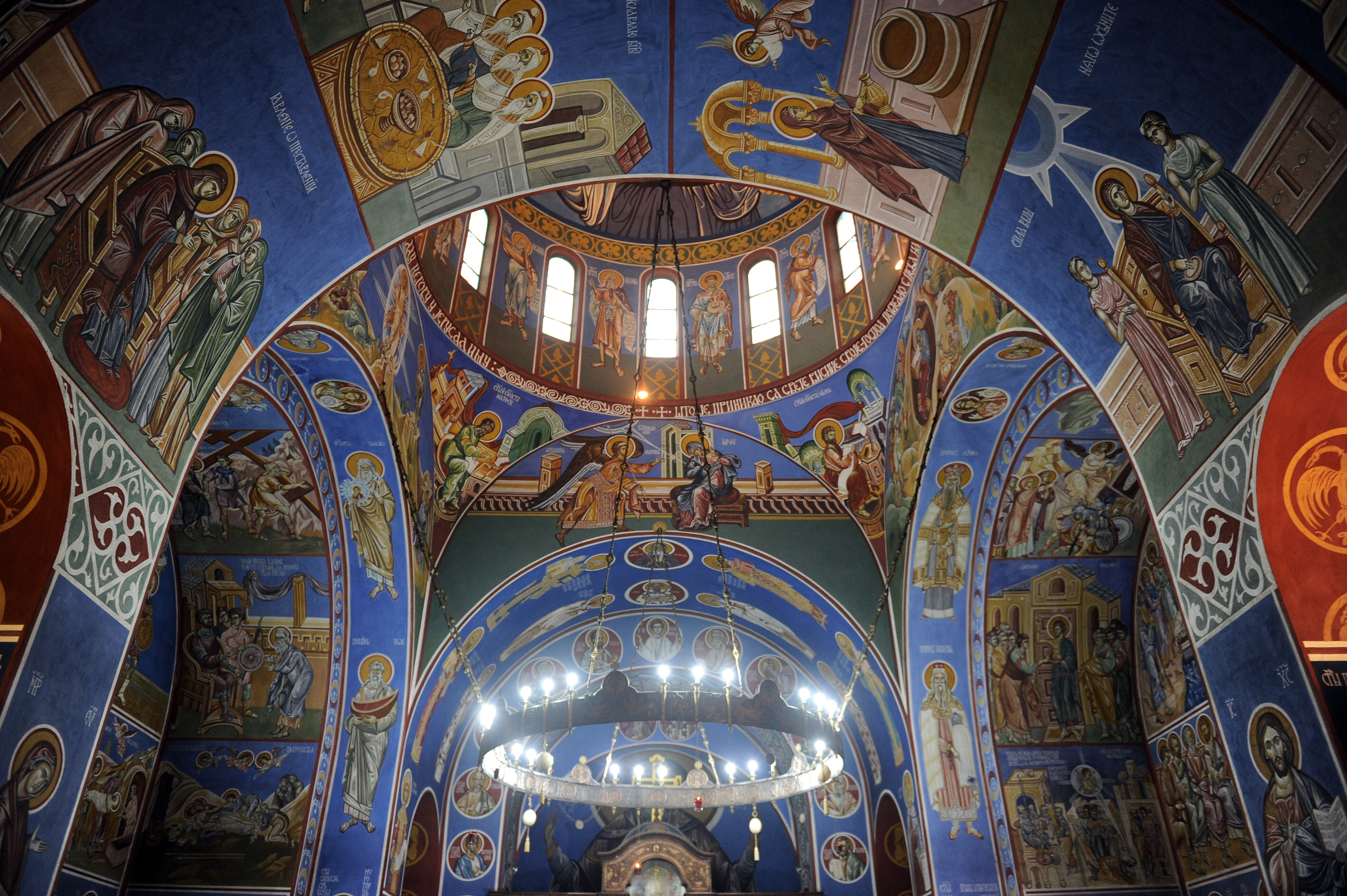 Church interior lavishly decorated with colourful murals.