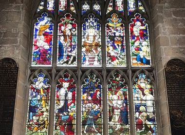 Stained glass window behind altar