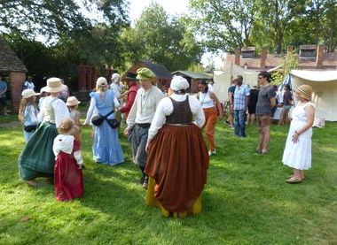 Civil War Reenactors in costume performing dance workshop with visitors