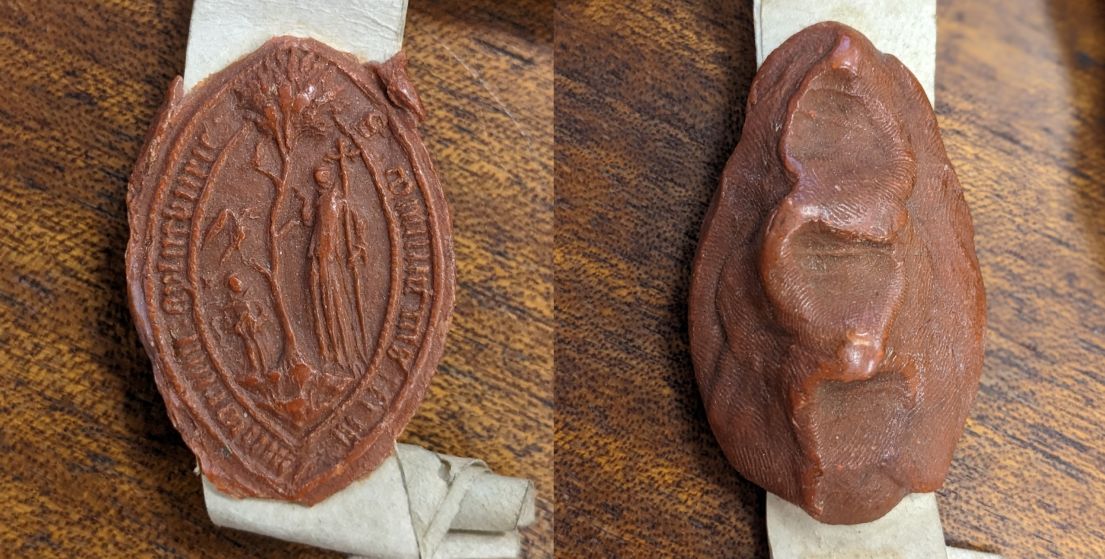 Front and back images of a red wax seal, showing the intricate designs which were once on the seals stamp.