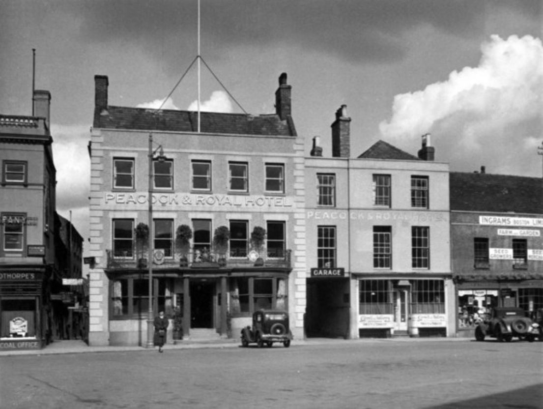 A black and white image of the Peacock and Royal pub.