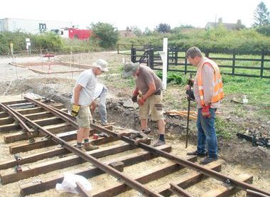 Volunteers re-laying the main line