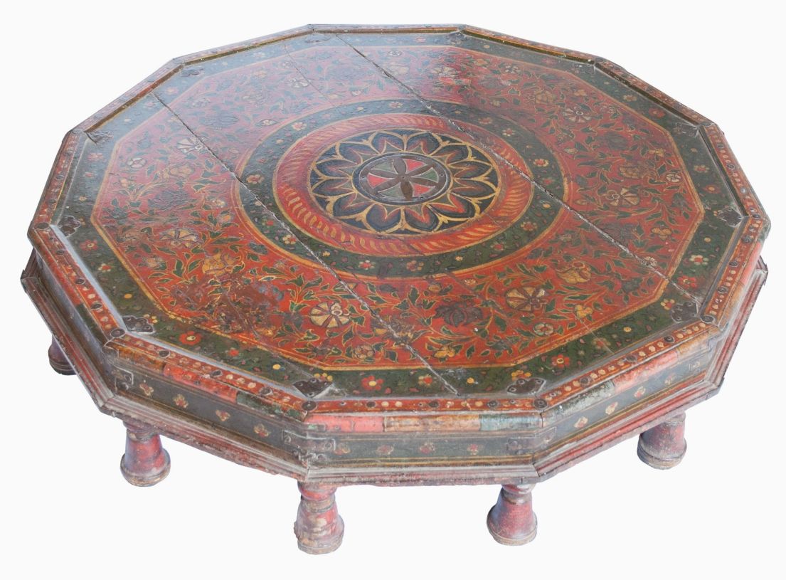 A broad low level 12 sided patterned wooden stool or table.
