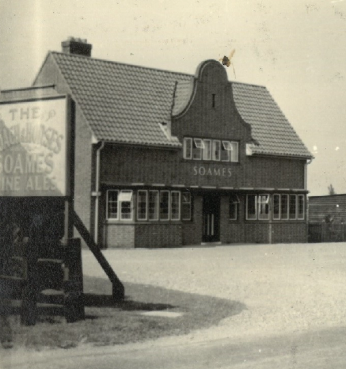 A black and white picture of 'The Coach and Horses' Soames pub.