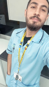 Selfie of a young man in medical uniform.