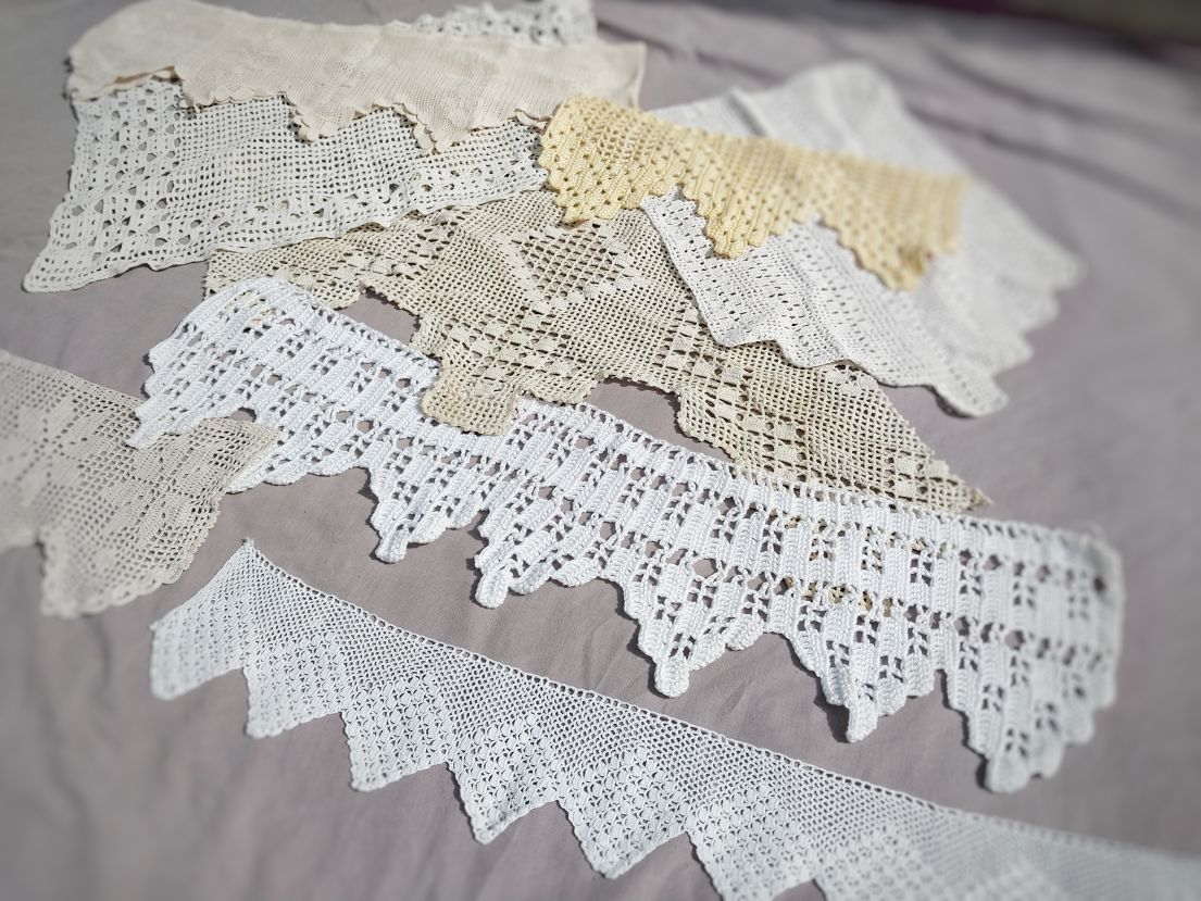 Several pieces of lace laid out on a table