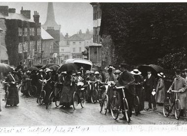 Cycling suffragists from across Sussex on the 22 July 1913 Suffrage Pilgrimage caught in the rain at Cuckfield.  Kind permission of West Sussex Record Office