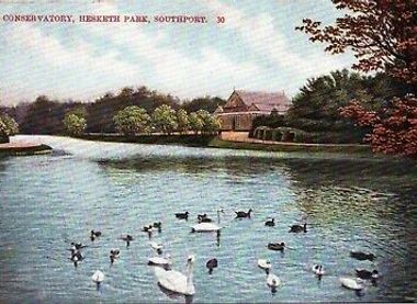 The Conservatory seen across the lake in Hesketh Park in the 1920s.